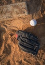 Baseball glove and ball on pitcher`s mound top view Royalty Free Stock Photo