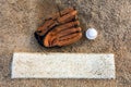 Baseball and glove on pitcher`s mound flat lay Royalty Free Stock Photo