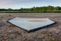 Second base closeup on field early morning Royalty Free Stock Photo