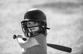 Baseball kid player in baseball helmet and baseball bat. Royalty Free Stock Photo