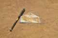 Baseball left bat on home plate Royalty Free Stock Photo