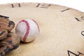 A baseball and mitt on an old vintage cloc Royalty Free Stock Photo