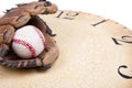 A baseball and mitt on an old vintage clock Royalty Free Stock Photo