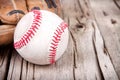 Baseball and mitt on wooden background Royalty Free Stock Photo