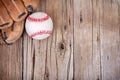 Baseball and mitt on wooden background Royalty Free Stock Photo