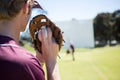 Baseball pitcher holding ball in glove at playing field Royalty Free Stock Photo