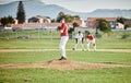 Baseball pitcher, match and athlete throw or pitch ball in a game or training with a softball team. Sports, fitness and Royalty Free Stock Photo