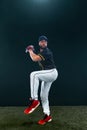 Baseball player on dark background. Ballplayer portrait.