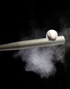 Baseball player hit ball with silver bat and sand soil explode in air. Baseball players in dynamic action hit ball smoke tail.