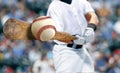 Baseball player hitting ball with bat in close up Royalty Free Stock Photo