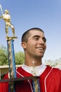 Baseball player holding trophy Royalty Free Stock Photo