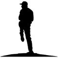 Baseball player, pitcher while throwing ball. Pitcher throwing a ball on pitcher mound. Detailed realistic silhouette Royalty Free Stock Photo