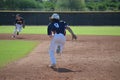 Baseball player running to second base