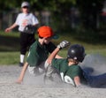 Baseball player sliding into b