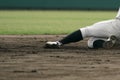 Baseball player sliding into a base Royalty Free Stock Photo