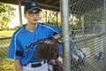 A baseball player standing on the playground