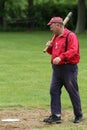 Baseball player in 19th century vintage uniform during old style base ball play