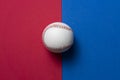Baseball on red and blue table background, top view sport concept Royalty Free Stock Photo
