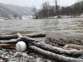 A baseball on the river banks of West Virginia