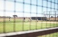 Baseball season starts now. a group of young men playing a game of baseball.