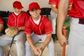 Baseball team-mates in dugout Royalty Free Stock Photo