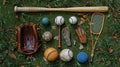 Baseball and Tennis Equipment Laid Out on Grass