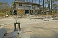 Baseball trophy and debris in front of house heavily hit by Hurricane Ivan in Pensacola Florida