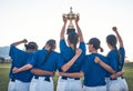 Baseball, trophy and team celebrate win with women outdoor on a pitch for sports competition. Behind professional