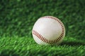 Baseball used put on green grass background. Royalty Free Stock Photo