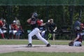 Baseballer in action on the field Royalty Free Stock Photo