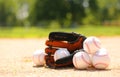 Baseballs and Glove on Field Royalty Free Stock Photo