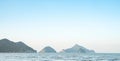 Based on the keywords you provided, a possible title for your Dreams"Summer Seascape with Hills in the Background". Royalty Free Stock Photo