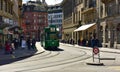Green tram driving through the historic center Grossbasel. City of Basel, Switzerland Royalty Free Stock Photo