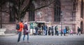 Customers lining up to buy hot chestnuts on Cathedral Square Royalty Free Stock Photo