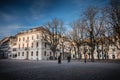 Warmly dressed people walk on cathedral square of Basel