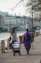 Jehovah witnesses walking in border Rhein with trolley