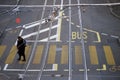 Portrait on top view of woman walking in the street on yellow pedestrian pathway