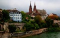 View of the Gothic red brick Basel Cathedral and the embankment of the Rhein River in the city of Basel, Switzerland Royalty Free Stock Photo