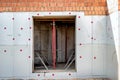 Basement insulation with foam. Insulation and waterproofing of the underground part of the building. Construction of the Royalty Free Stock Photo