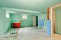 Basement renovation. Mint green walls and tile floor Royalty Free Stock Photo