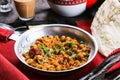 Basher Beans or channa masala, chick peas served in dish isolated on red mat top view on table arabic food