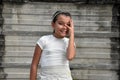 Bashful Cute Philippina Girl Near Wall