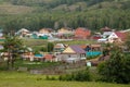 Bashkiria, 06.26.2021 - Village on a mountain in summer. Small houses with gardens