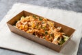 Bashu shredded chicken with sauce, spring onion, sesame seeds and cucumber served in dish isolated on wooden table side view of Royalty Free Stock Photo
