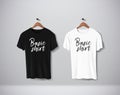 Basic Black and white short sleeve T-Shirts Mock-up clothes set hanging isolated on wall. Front side view with lettering for your