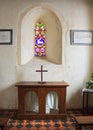 Simple Church Altar & stained glass window.