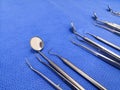 Basic Dental instruments Set Arranged On Blue Wrapping Sheet