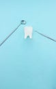 Basic dentist tools with tooth model molar on blue background. Healthy equipment tools dental care. Dentistry conceptual photo. Royalty Free Stock Photo