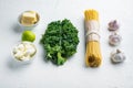 Basic ingredients for cooking pasta, green leaf, ricotta, parmesan, on white background Royalty Free Stock Photo