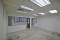 Basic office lot unit room with partition, lights under renovation, restoration, refurbishment or makeover for carpet installation